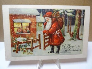 Cartolina Buon Natale in rilievo 1910 Babbo Natale al cancello con sacco di giocattoli - Foto 1 di 2