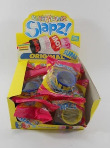 12 BRACCIALETTI SHOKKY BANDZ SLAPZ 6 COLORI 6 SCRITTE - Picture 1 of 1