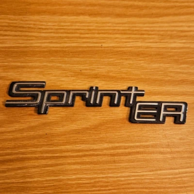 Chevrolet "Sprint ER" 1986-1987 emblema de guardabarros de plástico - como se quitó - Foto 1 de 4