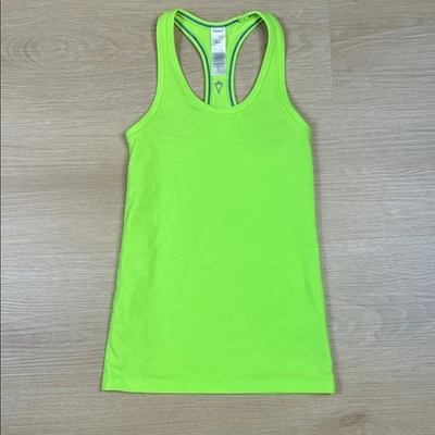 Camiseta sin mangas Ivivva verde brillante espalda cruzada para niña talla 7 Foto 1 de 4