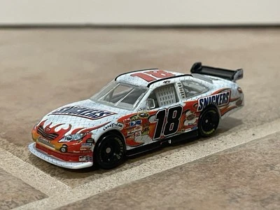 2009 Kyle Busch Snickers M&M’s Toyota Camry COT Joe Gibbs JGR NASCAR Action 1/64 - Image 1 of 4