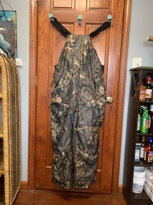 Bushmaster Mossy Oak/ Blaze Orange Camo Overalls Large - Image 1 of 3