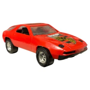 "Coche de juguete de plástico vintage STROMBECKER PORSCHE 928 negro 10"" techo corredizo TOOTSIETOY EE. UU. - Imagen 1 de 8