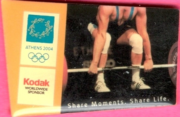 Dated 2004 Athens KODAK Olympic Weightlifting Games Mark Sponsor Sports Pin - Image 1 of 1