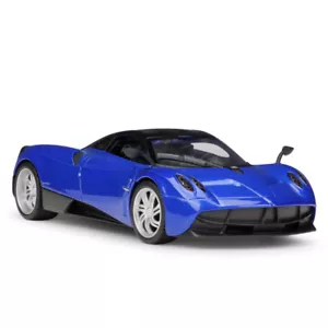 Welly 1:24 Pagani Huayra Roadster Modello Auto da Corsa pressofuso NUOVO IN SCATOLA Blu - Foto 1 di 6