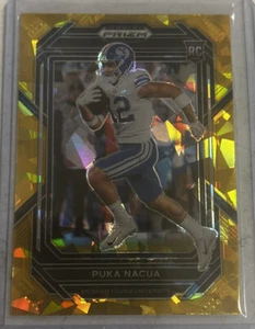 Selecciones del draft Panini Prizm 2023 Puka Nacua Gold Cracked Ice Rookie SSP #197 Rams - Imagen 1 de 2