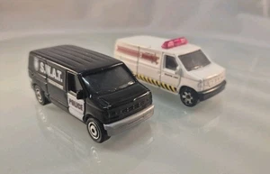 Matchbox Ford Panel Van Pair - White 2009 & Police Squad "SWAT" Black 2010 - Picture 1 of 7