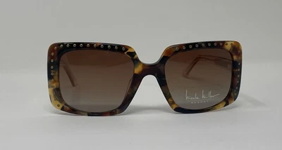 Gafas de sol Nicole Miller marrón tortuga con puntos dorados, lentes marrones polarizadas.  Foto 1 de 3