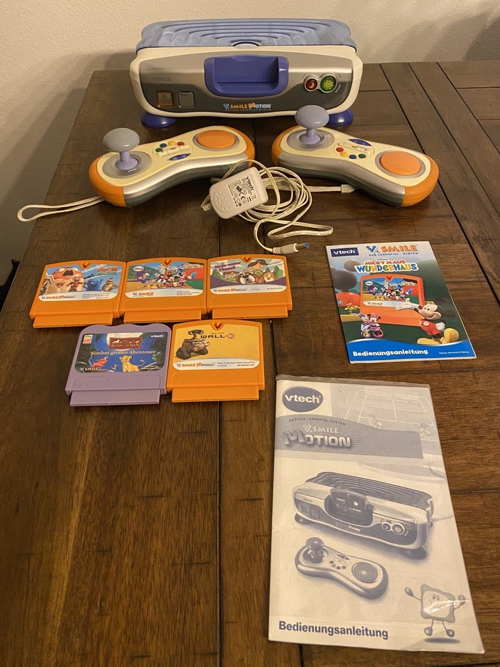 vtech V.SMILE MOTION KONSOLE inkl. 2 Controller 5 Spiele u.a. Mickey Maus, Simba - Bild 1 von 4