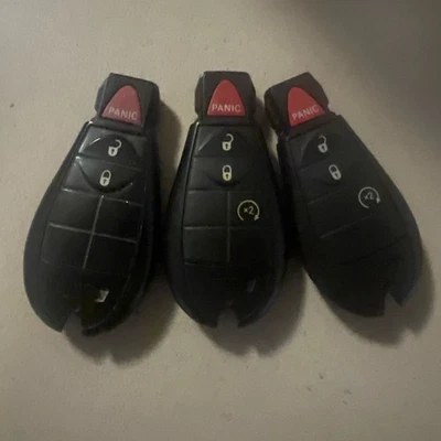 UNLOCKED lot of 3 oem Dpdge Ram remotes tested and working ID 4c chip - Image 1 of 2
