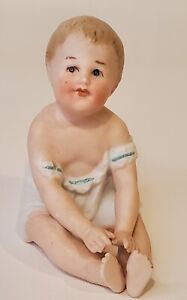 Vintage Piano Baby Porcelain Bisque Painted Sitting Hands in Lap Figurine