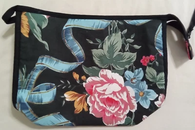 VINTAGE REVLON FLORAL COSMETIC BAG ON BLACK BACKGROUND ZIPPER AND SNAP CLOSURE - Image 1 of 3