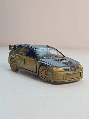 Subaru Impreza WRC 2007 Mudsplash escala 1/36 PULL BACK & GO Kinsmart Diecast Foto 1 de 4