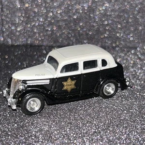 1990 Ertl Dick Tracy Police Car '36 Ford Limousine schwarz/weiß bicolor 1:64 R731 - Bild 1 von 5