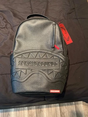 mochila sprayground edición limitada, negra y roja, ligeramente usada, sin daños Foto 1 de 4