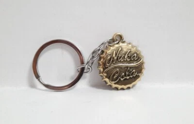 Fallout 4 Nuka Cola Schlüsselanhänger Kronkorken Goldfarbig Limitiert Neu - Bild 1 von 3