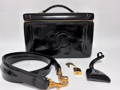 Auténtico bolso tocador Chanel charol 2 vías negro dorado CC Foto 1 de 4