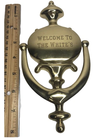 Brass Door Knocker Engraved With Welcome To The White’s Cover