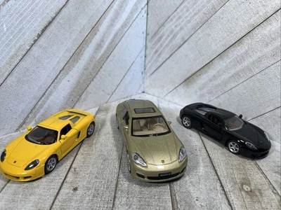 Porsche Pullback Toys 3 Kinsmart Kintoy MSZ Carrera y Panamera amarillo negro tostado Foto 1 de 4