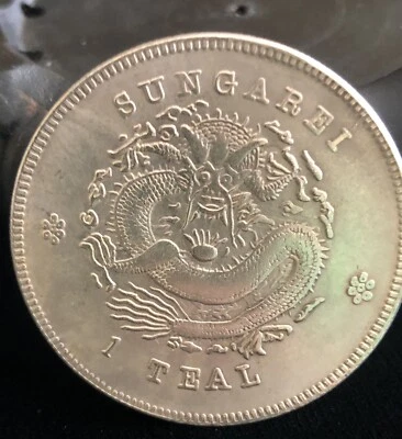 SUNGAREI, With Dragon”~ 1 Teal~ Large Coin, Silver Tone Color - Image 1 of 4