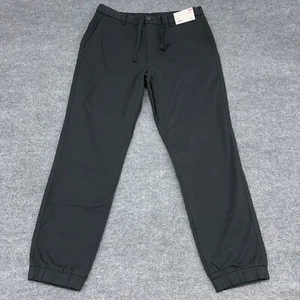 Uniqlo Hose Herren L dunkelgrün schwarz Jogger Stretch Tapered Taschen Kordelzug - Bild 1 von 8