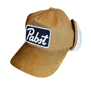 Lammfellmütze Pabst blaues Band mit Ohrenklappen hellbraun verstellbar Kappe - Bild 1 von 4