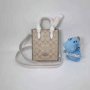 Coach CJ494 North South mini tote tracolla in tela firmata gesso kaki nuova con etichette - Foto 1 di 7