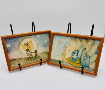 Par de pequeñas imágenes artísticas enmarcadas fantasía niña montando caracol girasoles alegre Foto 1 de 4