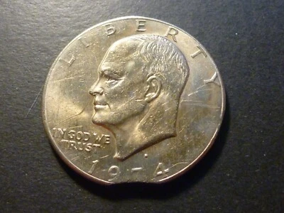 Error: US 1974D Eisenhower Dollar with curved clip (from Canadian collection) - Image 1 of 4