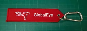 Global Eye Keyring embroidered double sided - Foto 1 di 2