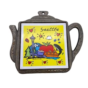 Vintage Seattle teapot shaped tile trivet Luke-a-tuke cast iron surround Washing - Picture 1 of 11