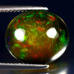 4.57 ct Topnotch Oval Cabochon (14 x 12 mm) Ethiopian Flashing Black Opal - Picture 1 of 2