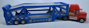 Transporte Mack de lanzamiento de autos Disney con remolque Dinoco 1:43 millas Cruz Lightning - Imagen 1 de 7