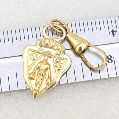 Vintage Gucci Knight Crest Shield Zipper Pull Key Chain Bag Charm Gold Tone - Image 1 of 4