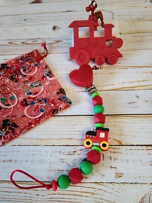 Tren de aprendizaje sensorial grande de silicona roja o tren de vacaciones con cadena de cuentas y clip Foto 1 de 4