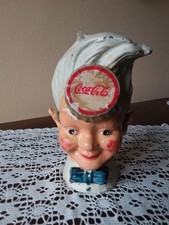 SALVADANAIO COCA-COLA TESTA DI SPRITE BOY IN GHISA IN OTTIMO STATO CON ALCUNI
