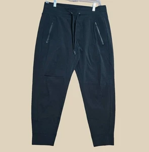 Athleta Trekkie Jogginghose Damen Petite Größe 10P schwarz Reißverschlusstasche zum Überziehen NEU - Bild 1 von 9