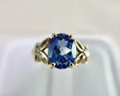 Vintage 10k Yellow Gold Synthetic Oval Blue Stone Round Diamond Cocktail Ring - Image 1 of 4