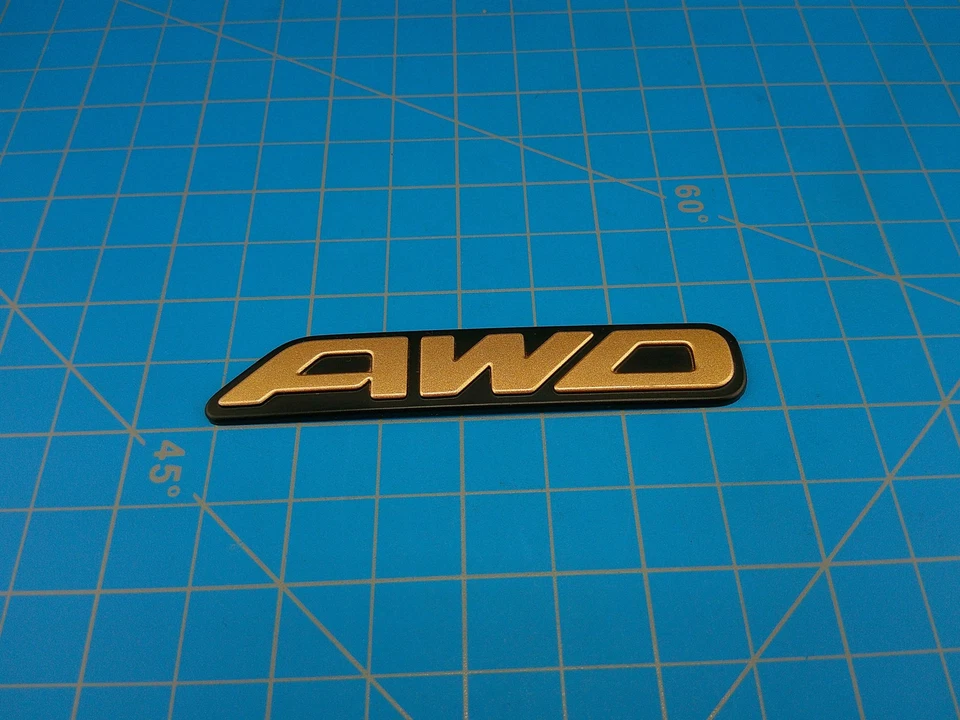 Subaru AWD Emblem Badge Gold Black Legacy 96-99 Genuine Replacement 93022ACC40 - Image 1 of 4