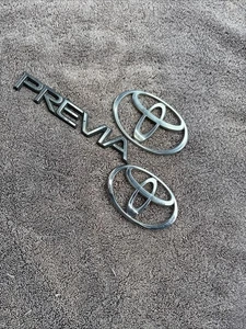 Toyota Previa Emblems Used (3) ** NEEDS NEW ADHESIVE TO INSTALL ** - Picture 1 of 17