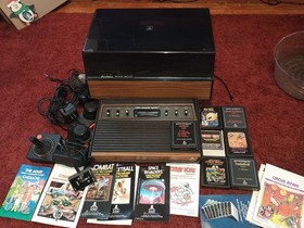 Atari 2600 W Games Paddles Joy Sticks And Game Center  For Parts