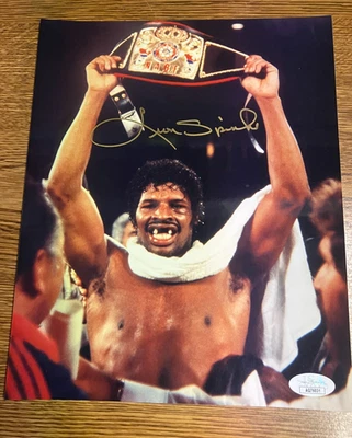 Leon Spinks, Signed 8 x 10 Photo, w/Heavyweight Champion Belt, JSA - Image 1 of 3
