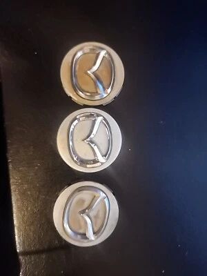 Juego de 3 tapacubos central Mazda RX8 2005 2006 2007 CB2874 usado Foto 1 de 2