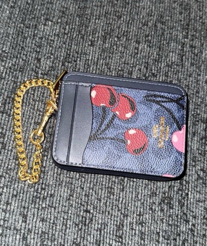 Coach astuccio porta carte zip tela firmato con stampa ciliegia e pelle in oro denim nuovo con etichette
