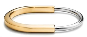 Brazalete Tiffany & Co. Tiffany Lock de oro amarillo y blanco de 18 k tamaño pequeño - Imagen 1 de 10