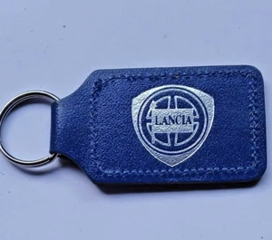 LANCIA SILVER FOIL PRINTED BLUE LEATHER ENGLISH KEYRING JOHN HOSMER BOVINGDON - Picture 1 of 2