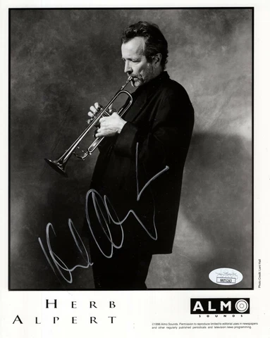 HERB ALPERT HAND SIGNED 8x10 PHOTO        GREAT POSE PLAYING TRUMPET       JSA Cover