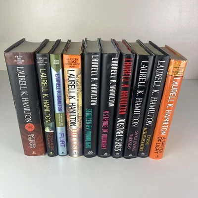 Lot 10 LAURELL K HAMILTON Mix Books Hardcover DJ 2 Vampire Hunter 7 Merry Gentry Foto 1 de 4