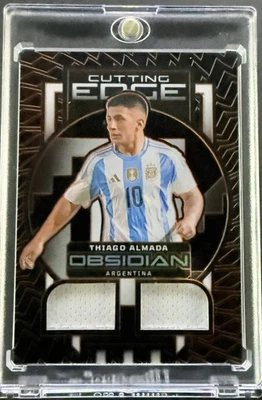 2023-24 Panini Obsidian #CE-TA Thiago Almada Cutting Edge Orange #/99 - Image 1 of 2