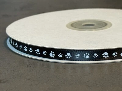 Single-Faced Black Ribbon with White Paw Prints – Decorative Craft Supply - Image 1 of 4